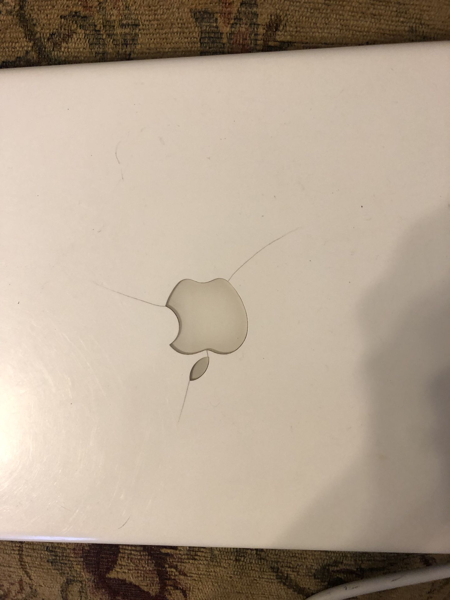 MacBook 2009; Needs a Battery; works when plugged up; Has small cracks on front of Case, doesn’t effect it working.
