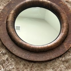 Brown textured circular mirror