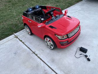 Red Kids SUV Ride-On Car with Charger with 12 volt BRAND NEW battery