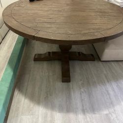 Large round wooden dining table 