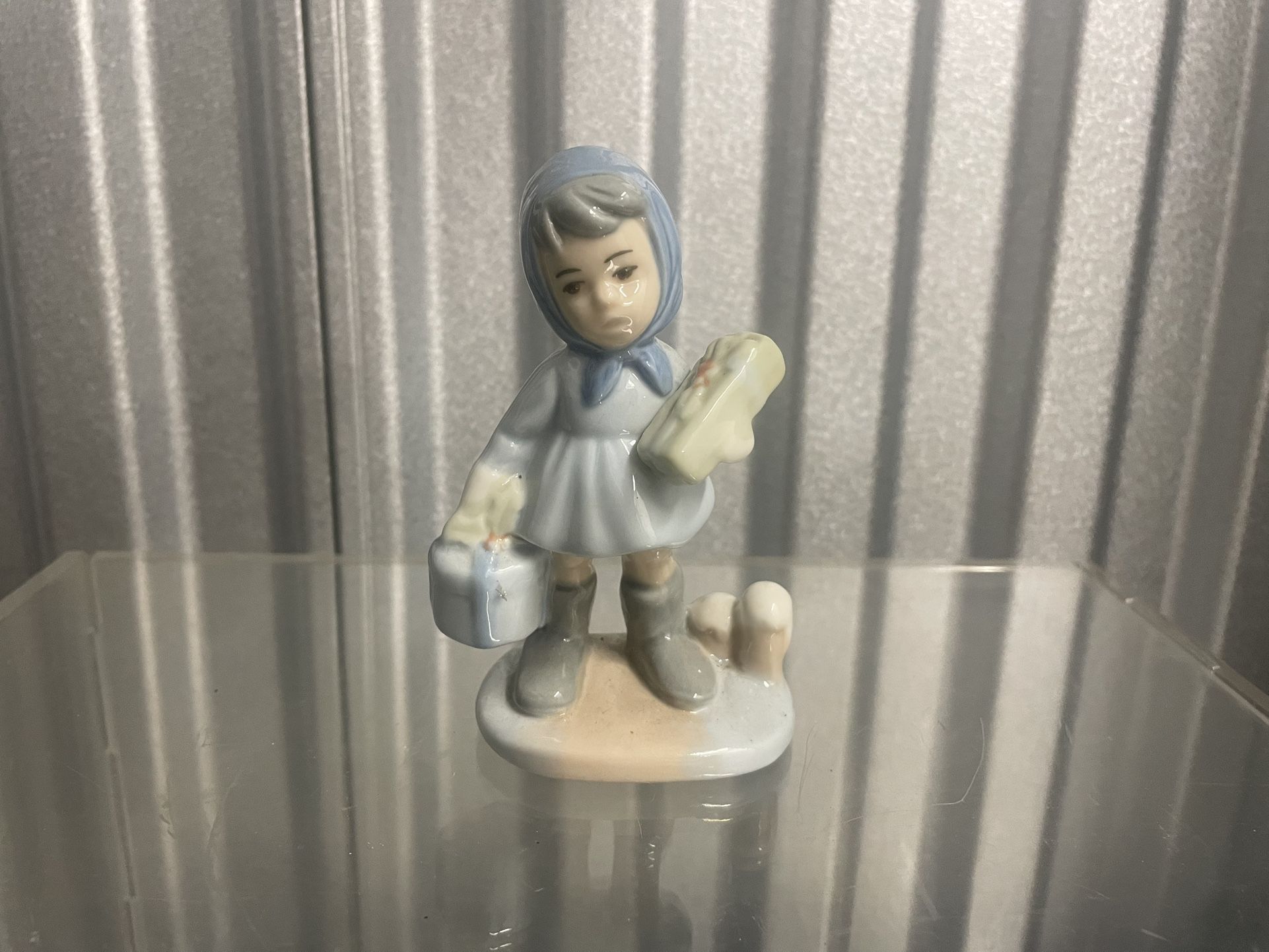 Porcelain Figurine of Girl with Gifts