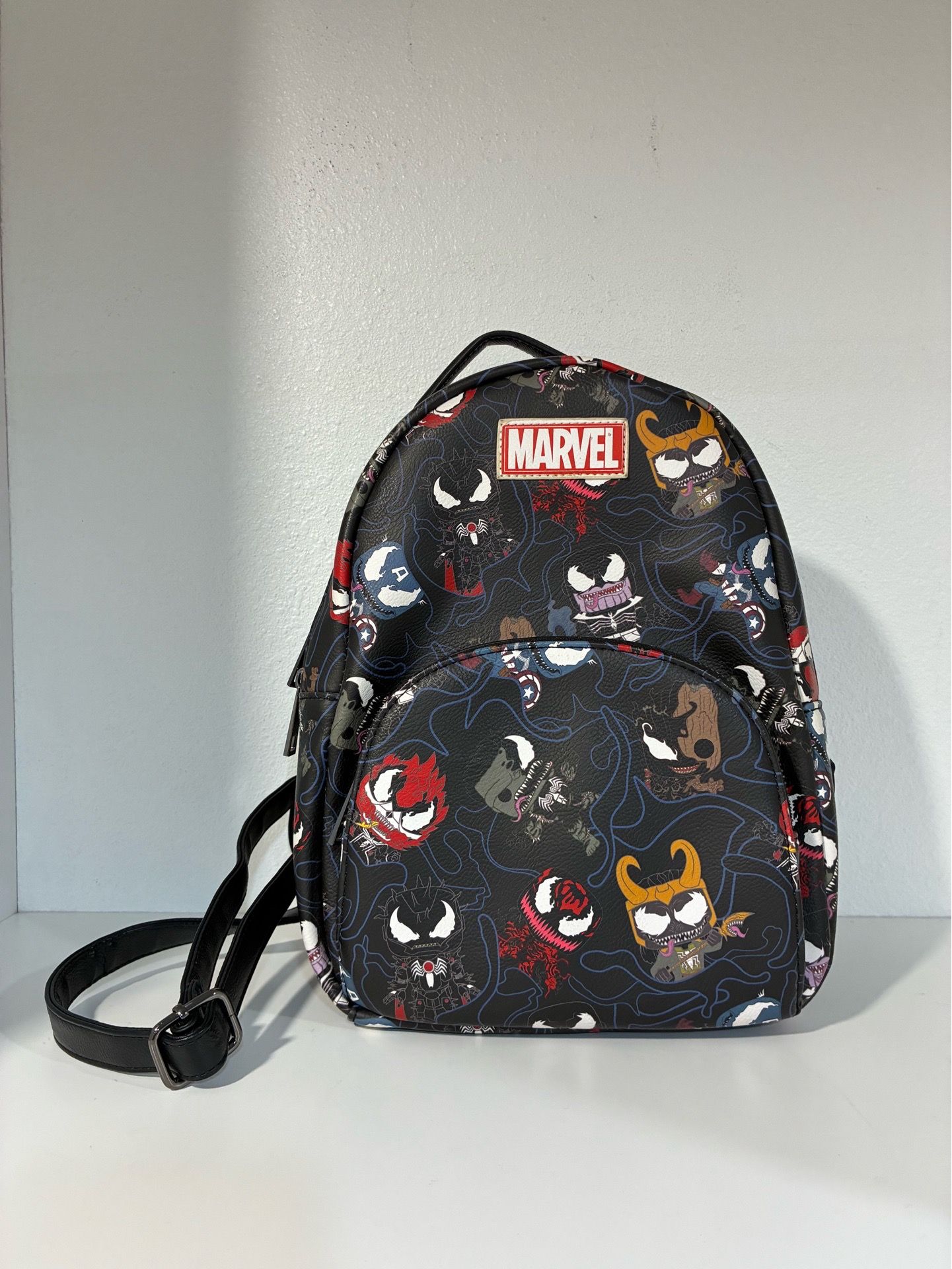 disney stitch mini backpack Disney's Lilo and -- Leroy and Stitch Genuine Leather Backpack for Telescopic Casting Rod Color:Matte Turquoise on Black The front zipper pocket