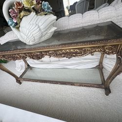 vintage console buffet table with gold wood framing and glass top and base