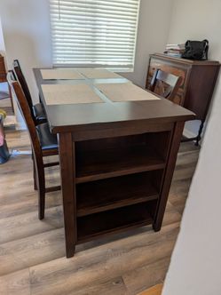 Dining room table with chairs and built-in shopping