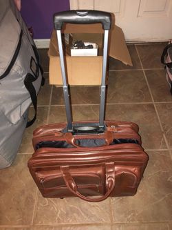 Brown colored/ high quality leather laptop rolling luggage