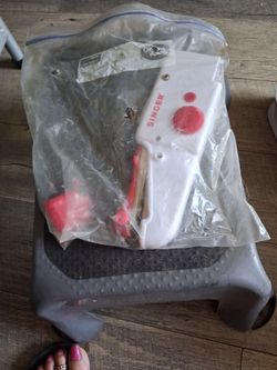 Hand held sewing machine