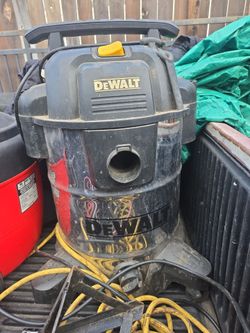 Dewalt shop vac in good condition, chrome, black top wet or dry on four wheels