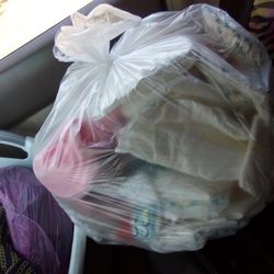 newborn diapers and some outfits 