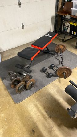 Bench With All Weights In Picture