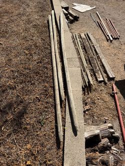 Assorted Used Lumber and Metal Pipes