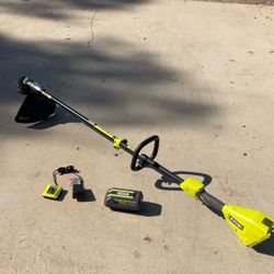 RYOBI 40V 15 in. Expand-It Cordless Battery Attachment Capable String Trimmer with 4.0 Ah Battery and Charger