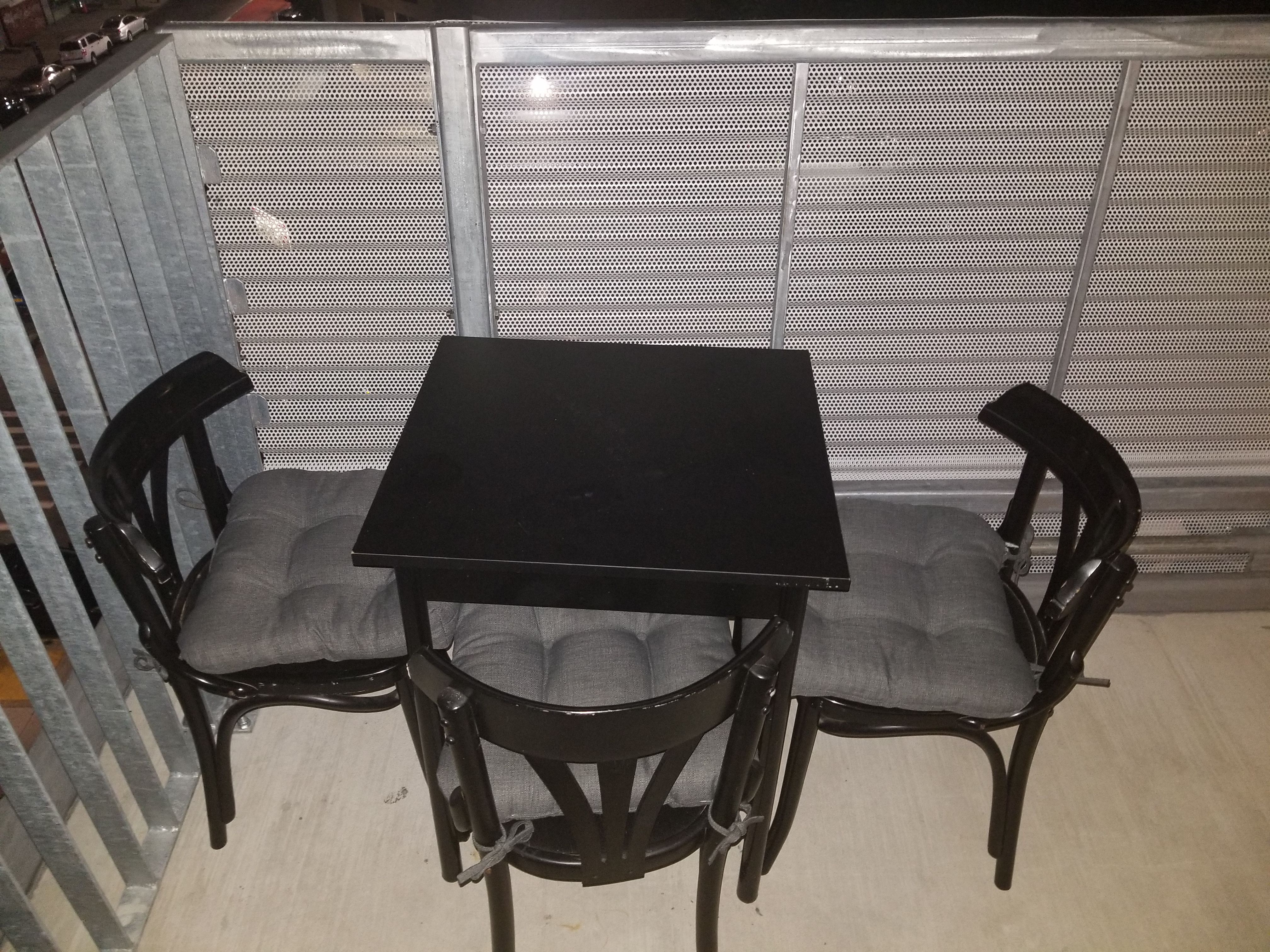 Small dining table + 2 (not 3) cushioned chairs (one chair was broken).