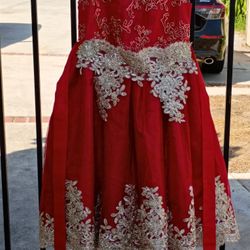 Red Dresses One is size 2T and the other is size 13