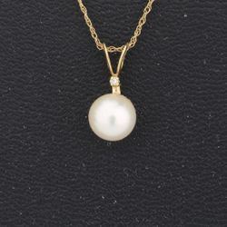 14kt Gold Pearl and Diamond Necklace from Designs by M with 2 maybe 3 link chain for strength. Diamond is all 58 facets. Pearl is 7 mm and the chain i