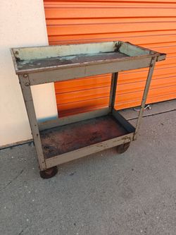 Vintage metal cart on wheels