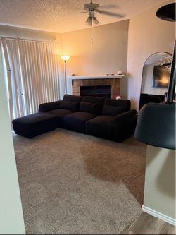 Black couches with ottoman