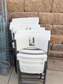 Durable white folding chairs, perfect for events. Total 9 for $100