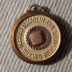 vintage Saint Elizabeth Ann Seton 3rd Class "touched" relic medal.