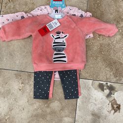 2 Baby outfits size 9 months New