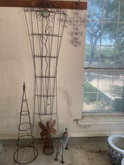 Rustic yards items: 2 trellises, vine tree, sunflower stake, Christ cross, angel, dachshund dog