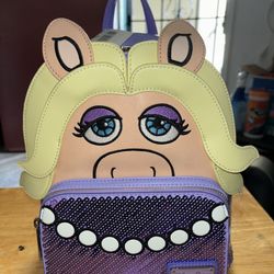 Several  Loungefly Backpacks 