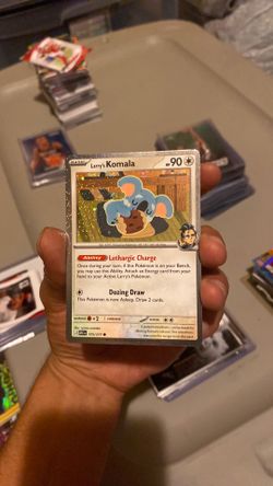 Larry’s Komala 175/217 Cosmos Holo NM Pokémon Card
