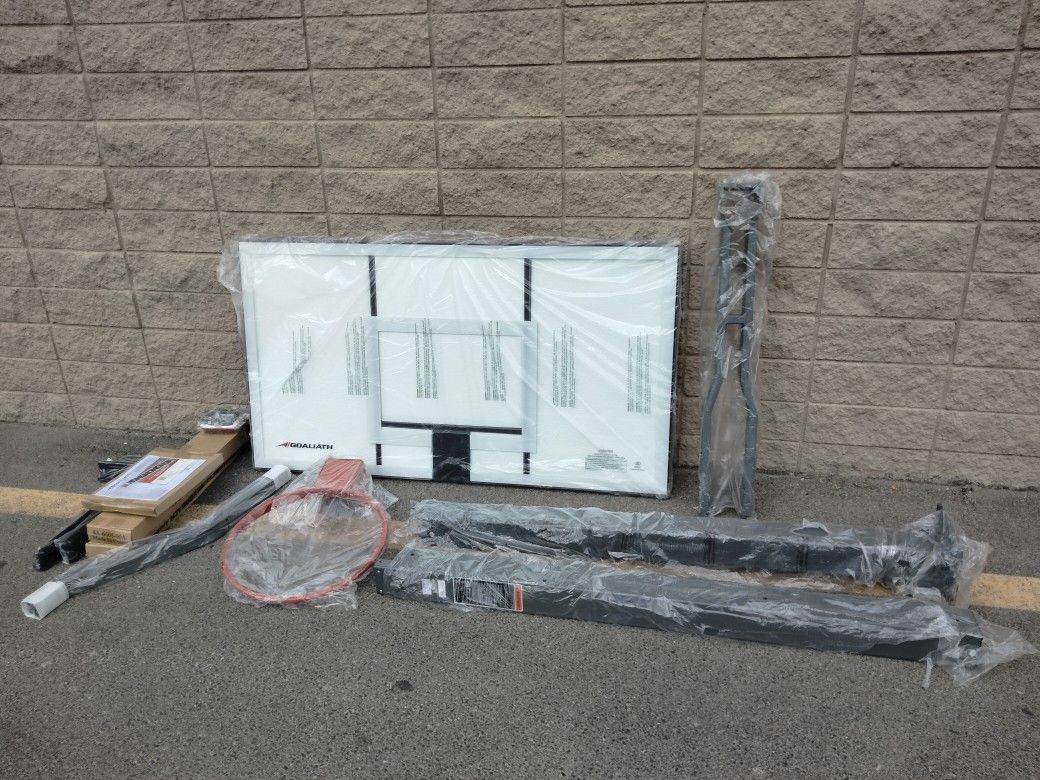 Goaliath 54 inch in ground basketball hoop, adjustable basketball court