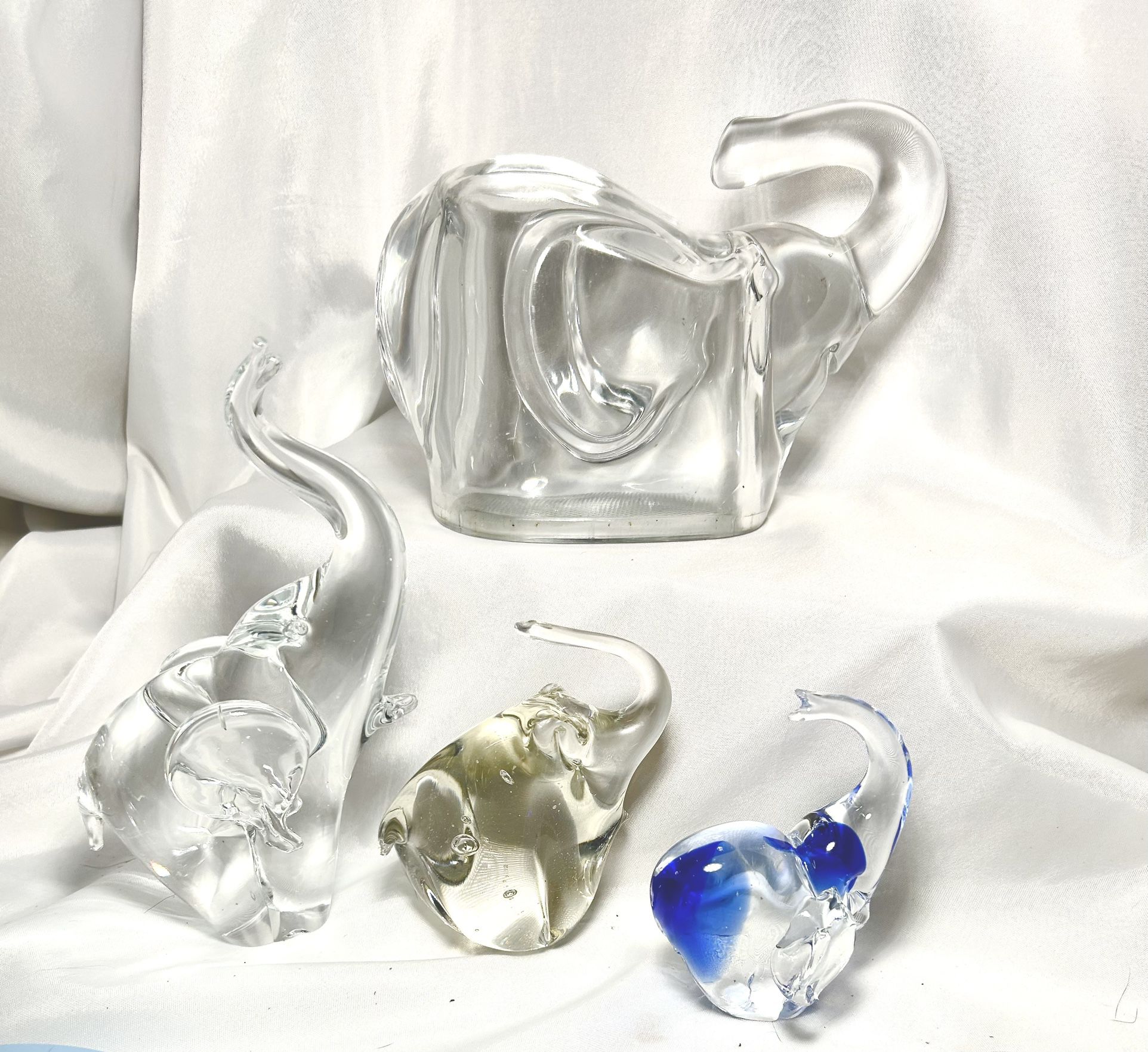 Glass Elephant figurines/ paperweights/piggy bank. all 4 have trunks up for good luck! Beautiful
