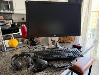 HP Computer monitor, Dell keyboard, Logi headset and Adesso cordless mouse