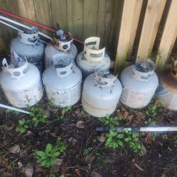 About Eight Or Nine Propane Tanks $15 Each Sum.Half Full