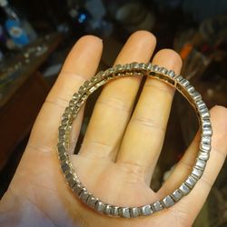 Premier Designs silver-tone herringbone or arrowhead style stretch bracelet. 
