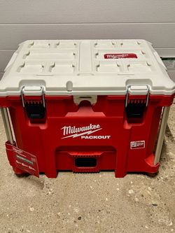 Brand new Milwaukee XL cooler and with cutting board,divider and dolly