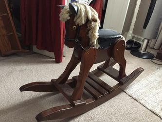 Amish hand made solid wood rocking horse.