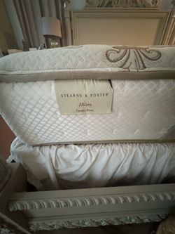 Used Sterns and Foster king’s Size mattress with box springs and metal bed frame.