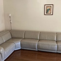 Cosmopolitan Gray Recliner sectional with power headrest from Bob’s discount furniture store