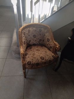 Two gold Barrel Rams Head Chairs