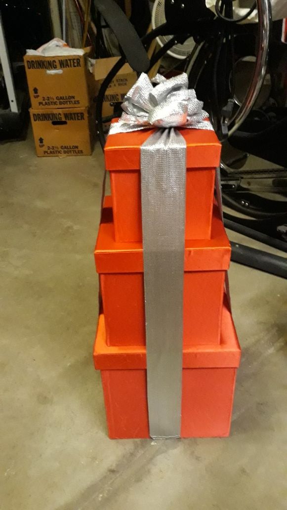 Stacking red satin boxes w/ sliver glittery bows