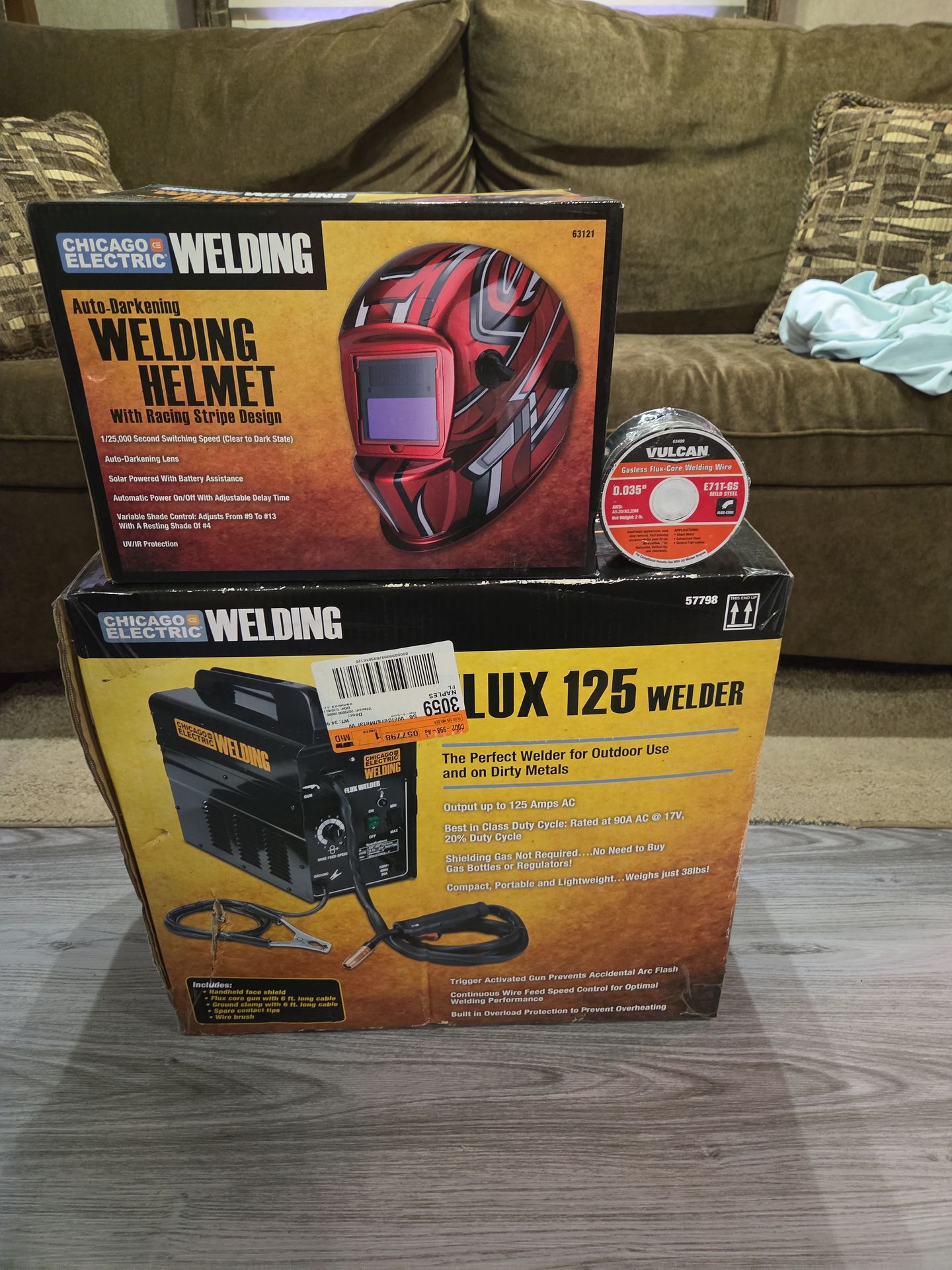 New in box Chicago electric welder, helmet, and wire.