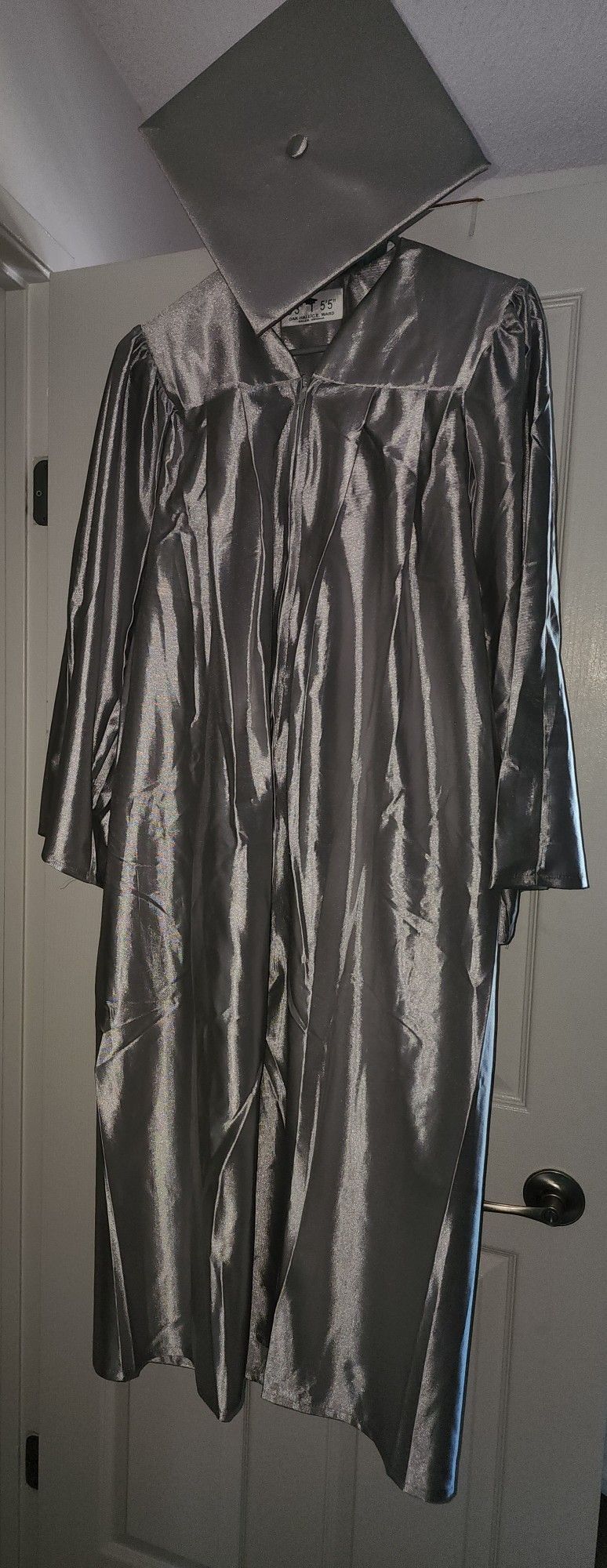 Silver Graduation Gown And Cap Plus Tassle