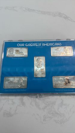Five one ounce pure silver Greatest Americans ingots.