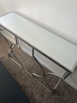 Thin skinny silver mirror table