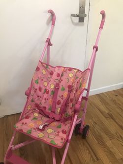 Pink and green lightweight stroller