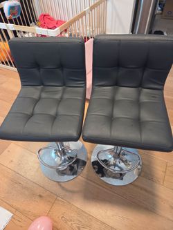 2 grey bar stools