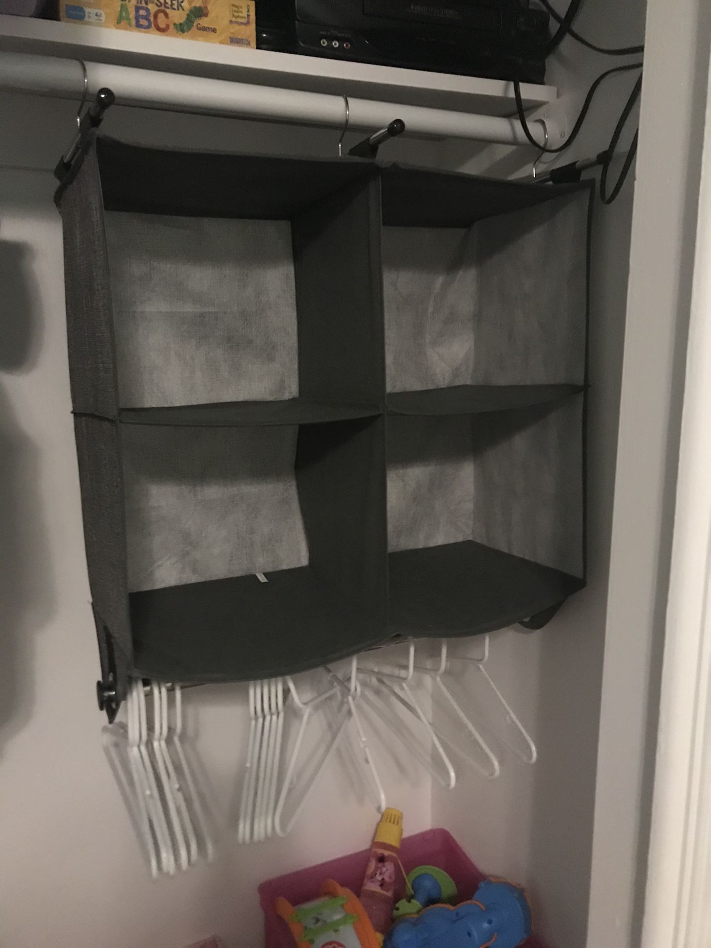 Closet organizer with rod on bottom