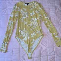 This bodysuit is size L, yellow with white flowers.
