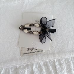 Black bow and rhinestones hair clip