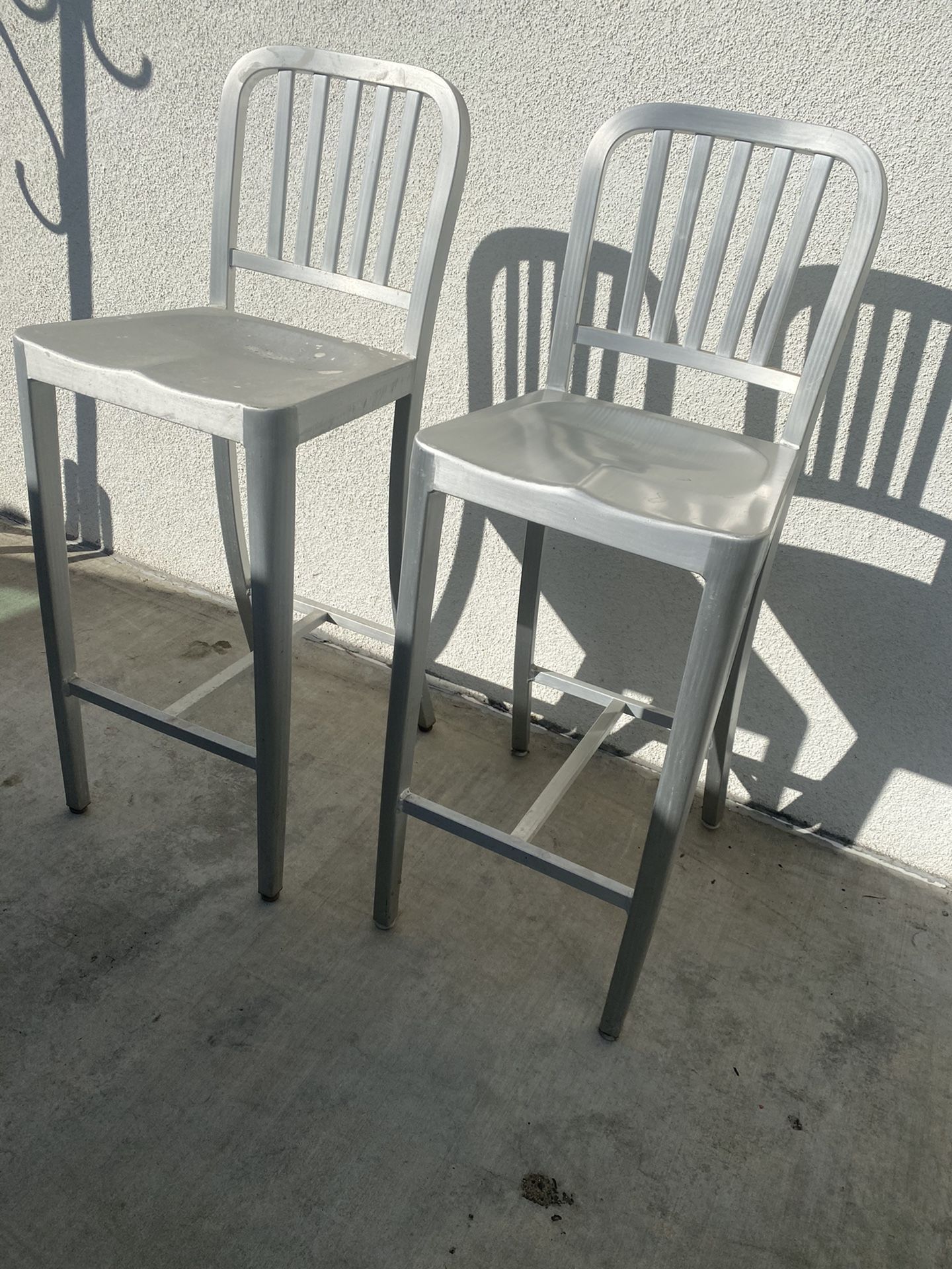 2 matching metal bar stools