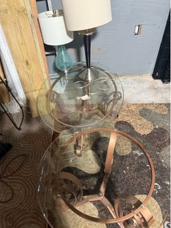 2 glass tables and 2 lamps