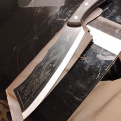 Japanese Knife With Dragon Engraved On It