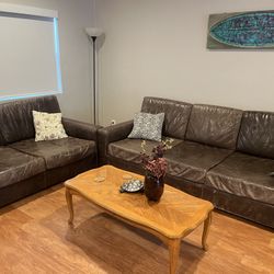 two Restoration Hardware Maxwell sofas in charcoal brown